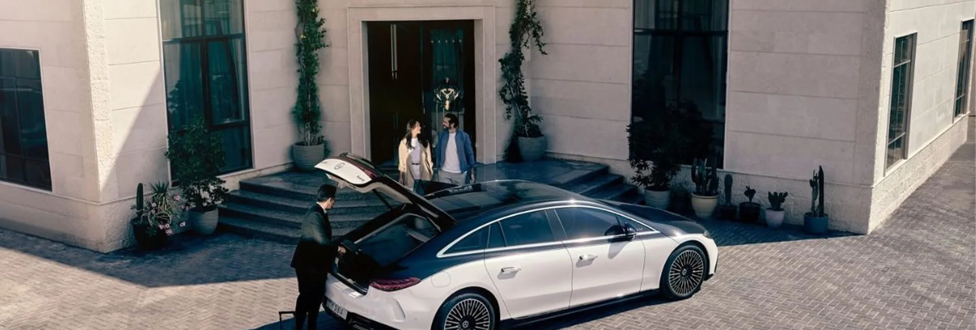 Travel partners: Black Drive chauffeur welcoming travellers for a travel partner booking