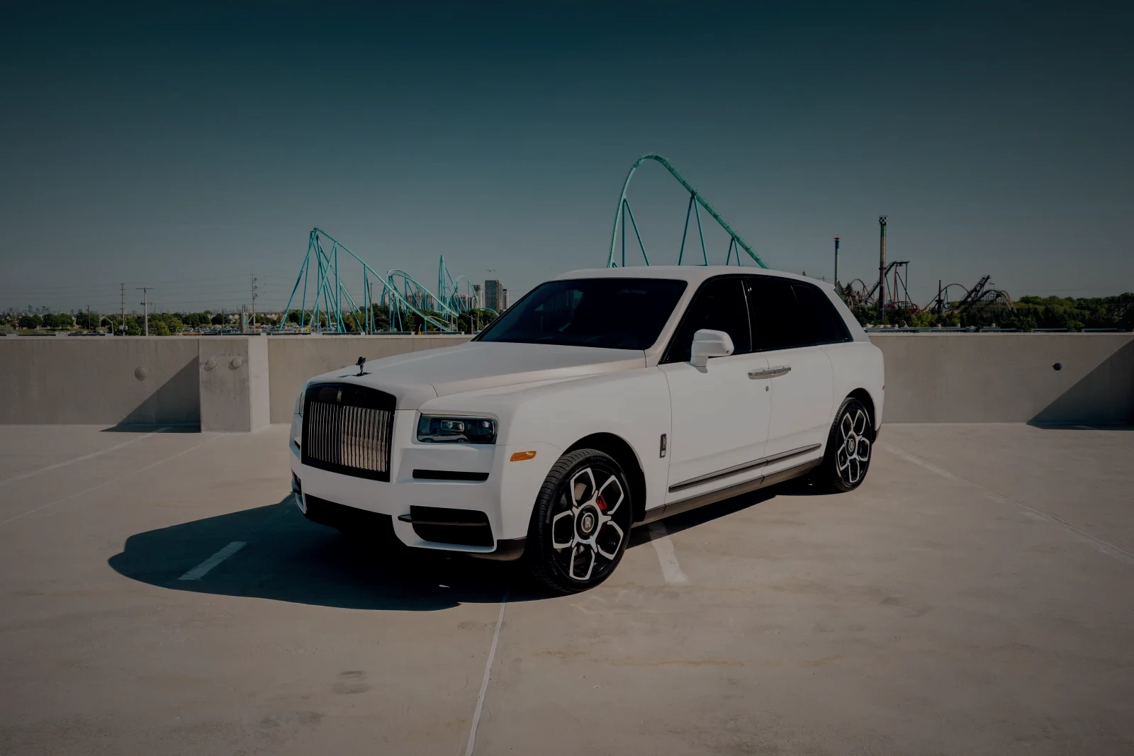 White Rolls-Royce Cullinan Black Badge SUV, front three-quarter view