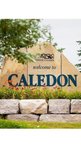 Pearson Airport to Caledon transfer – black SUV on a country road through the Caledon Hills