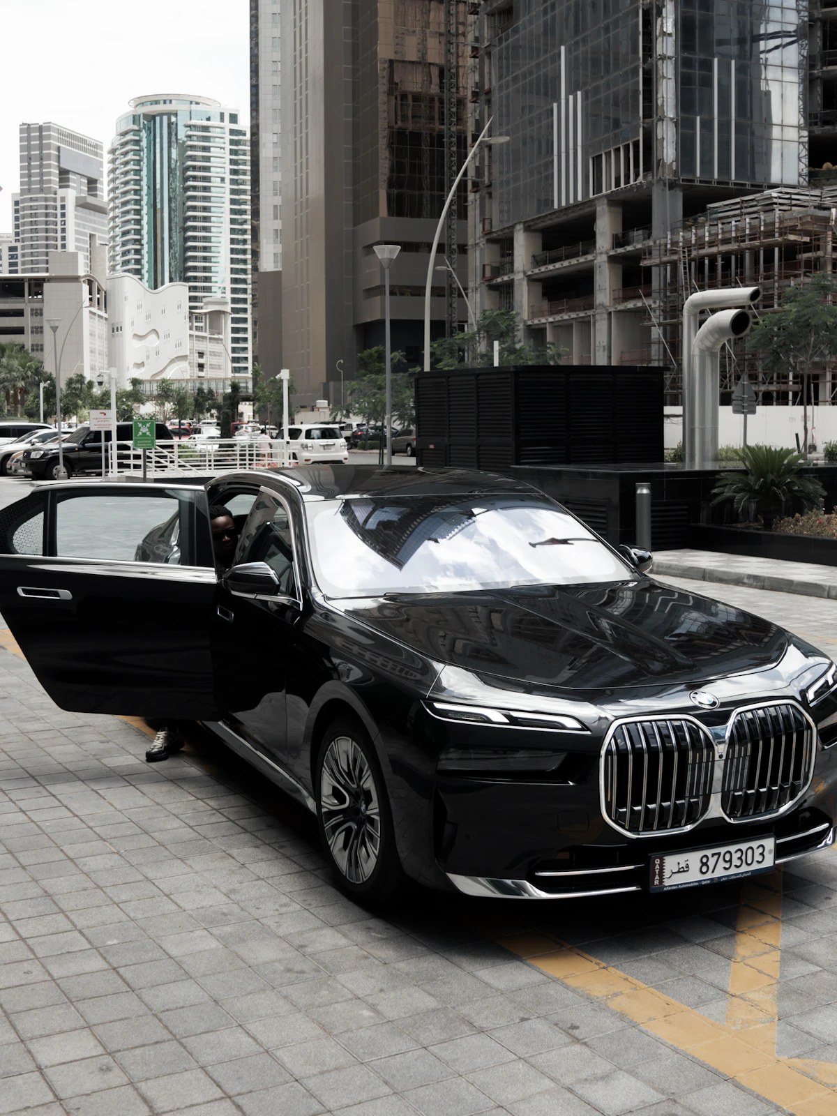 Black BMW 7 Series with its rear door open