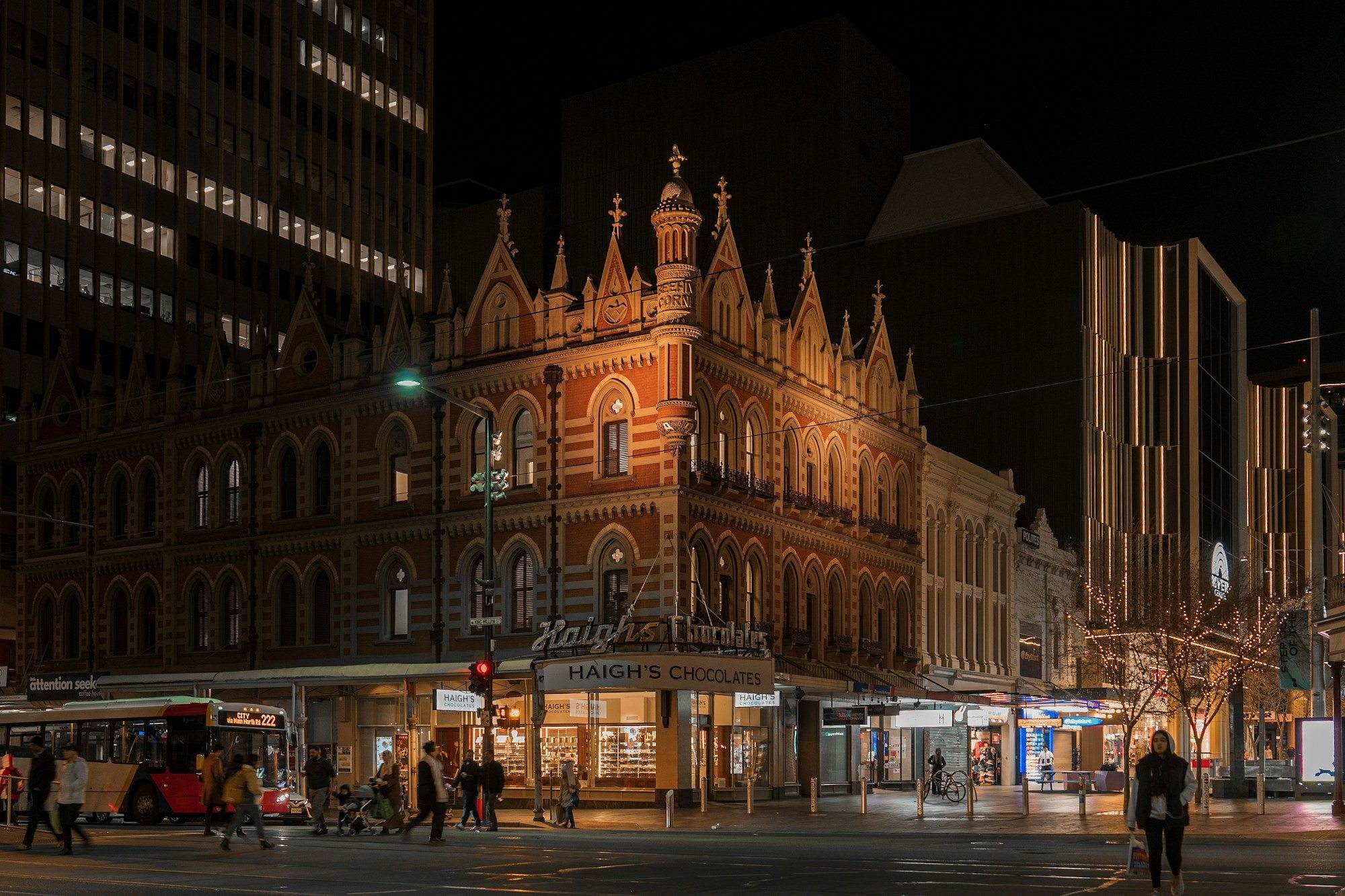 Adelaide airport transfer: Historic buildings lit up on an Adelaide street at night